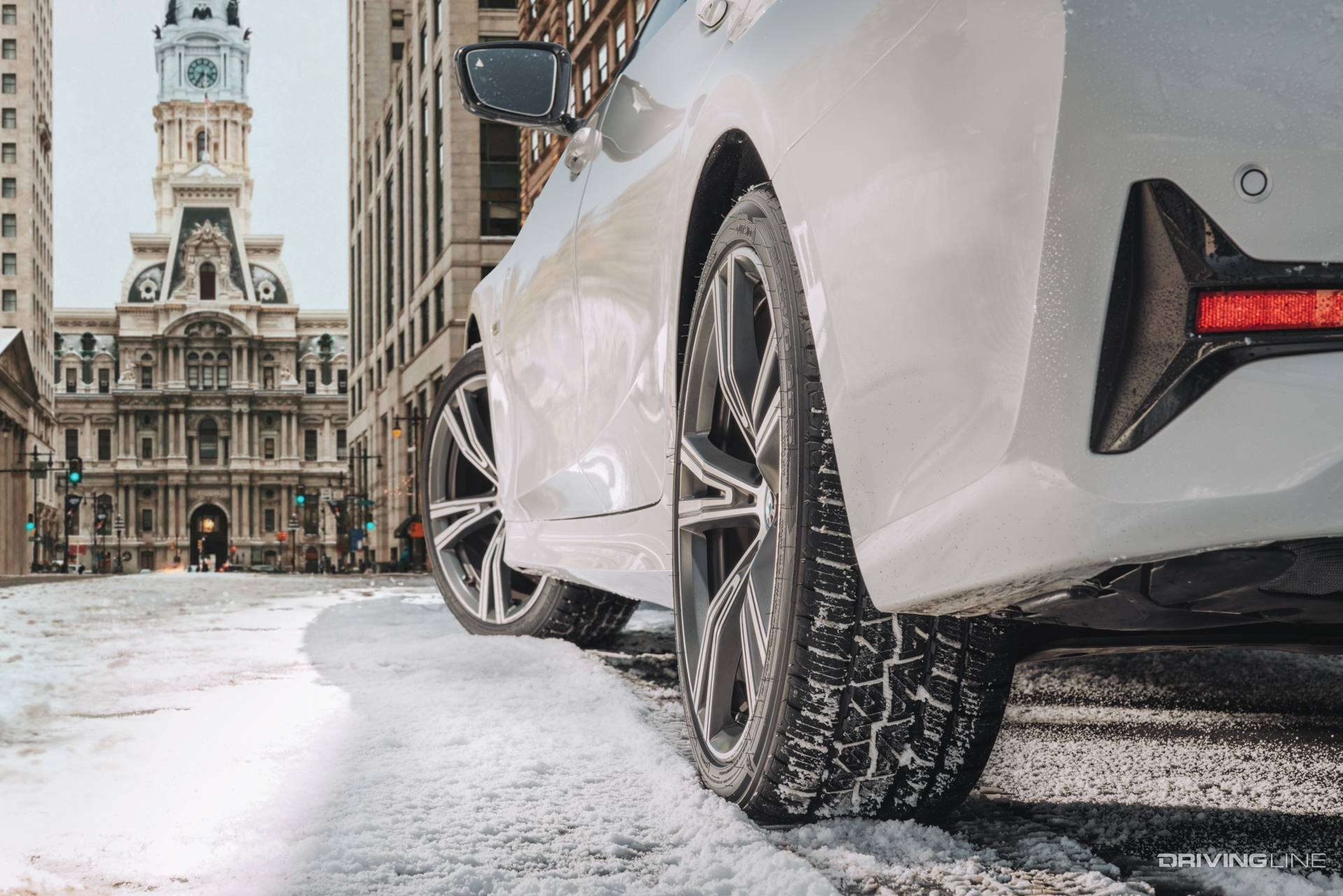 Nitto Motivo 365 all season tire on snow covered road driver side