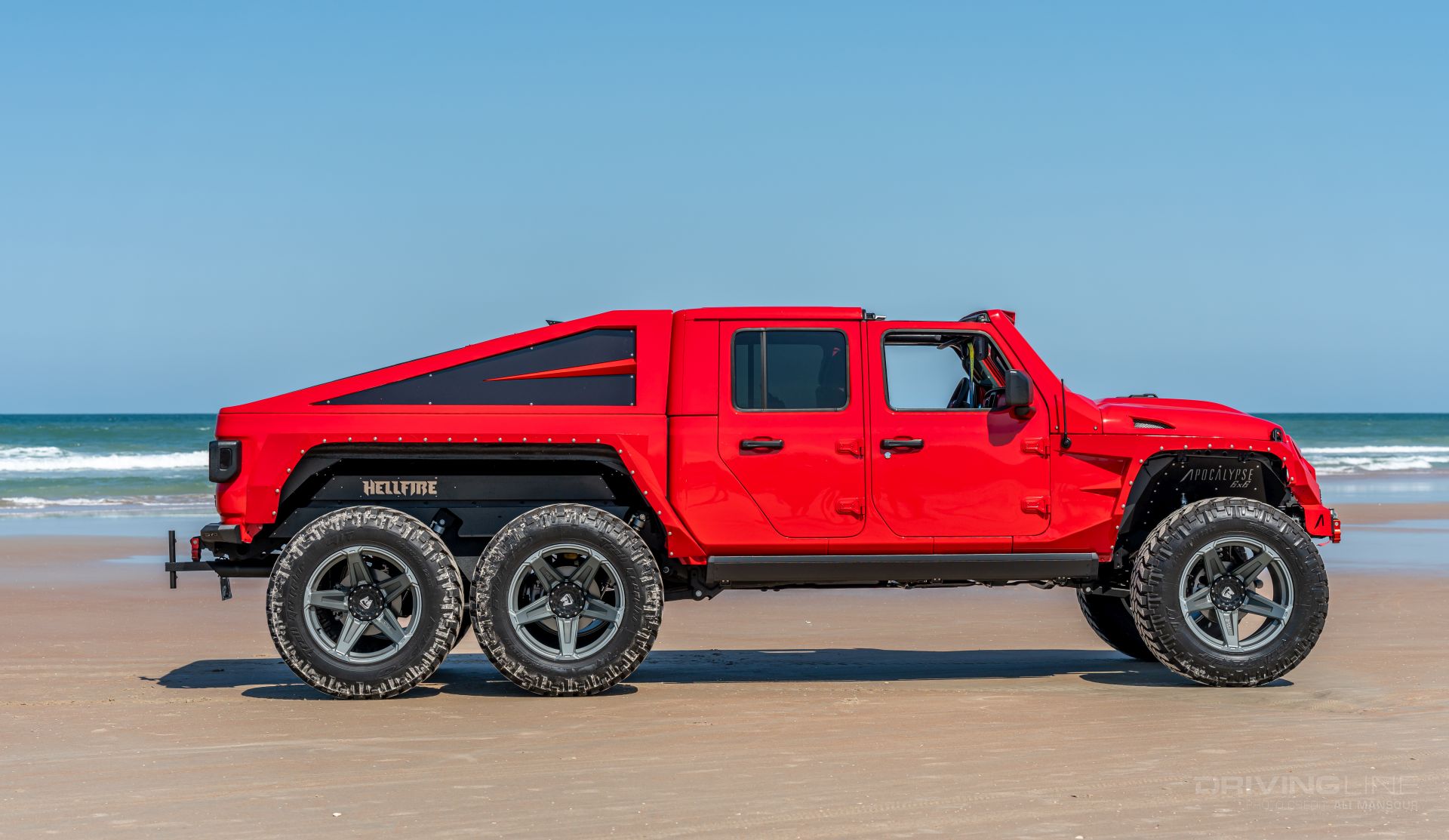 Jeep Gladiator 6x6 on 40s side view red Jeep Beach Daytona Beach