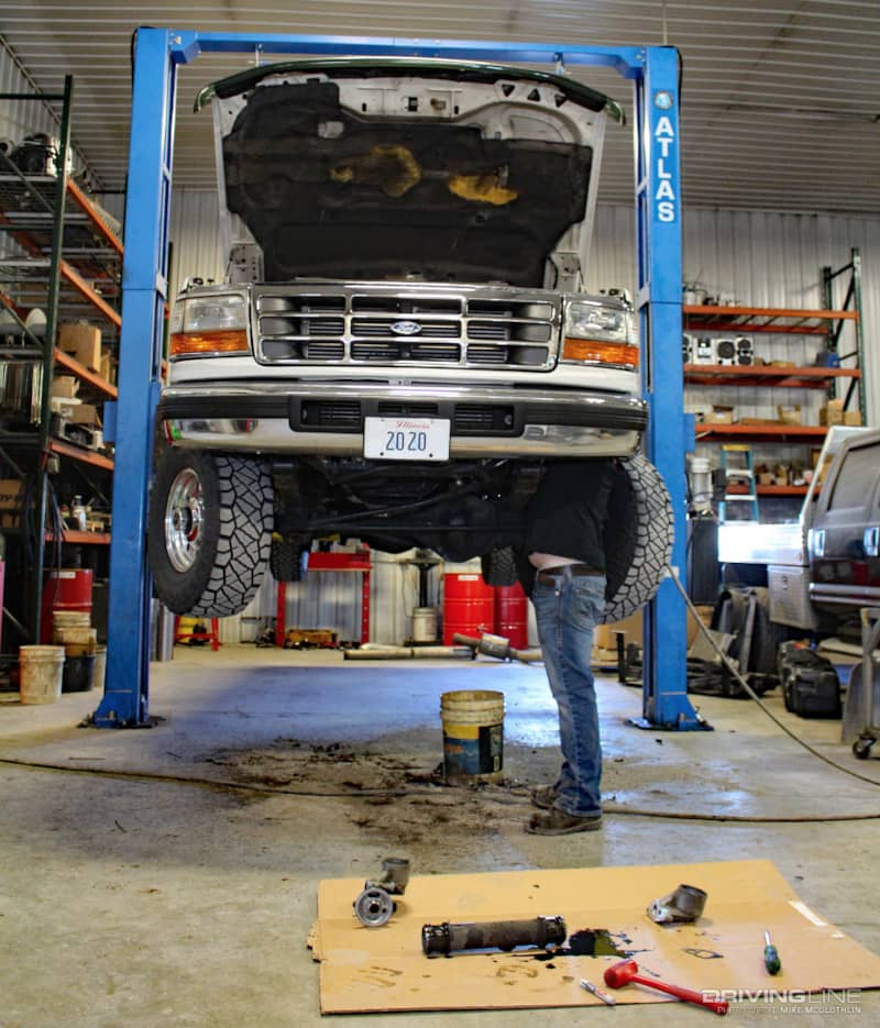 Ford pickup on lift for repairs
