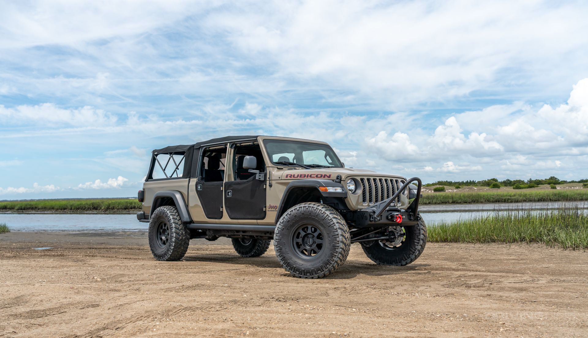 Jeep Gladiator Rubicon gator color on 38s 3 inch lift bestop half doors evo front bumper