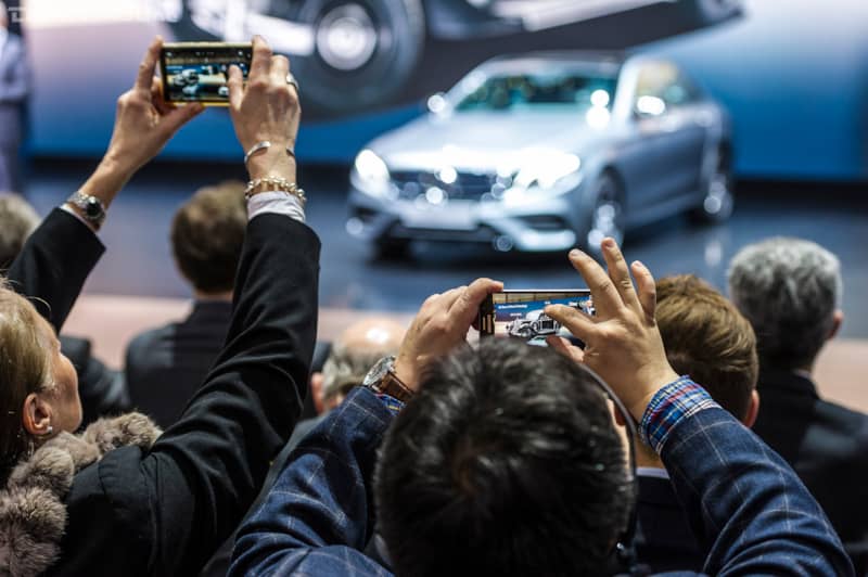 Spectators take photos at 2016 Geneva International Motor Show