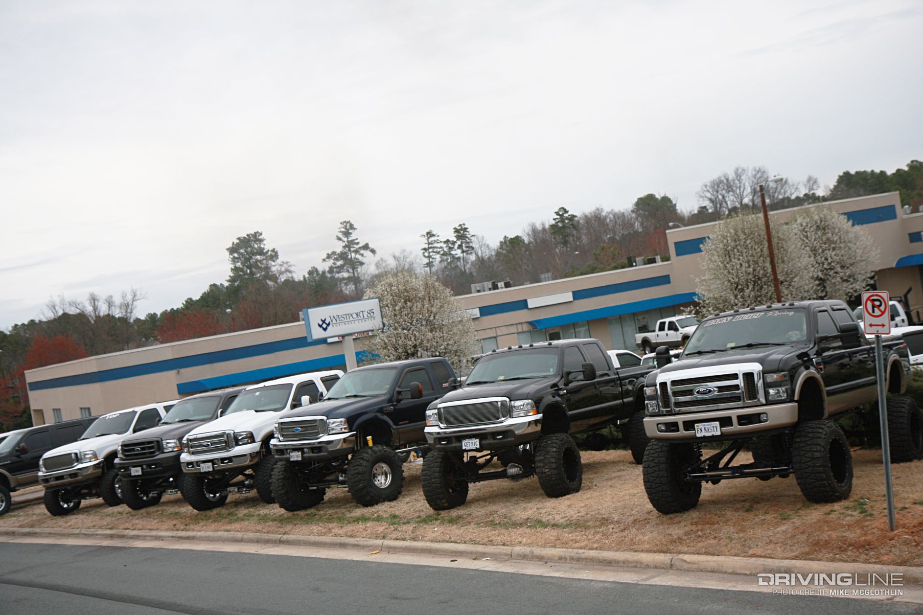 ford super duty trucks lined up at dealership on Mud Grappler tires