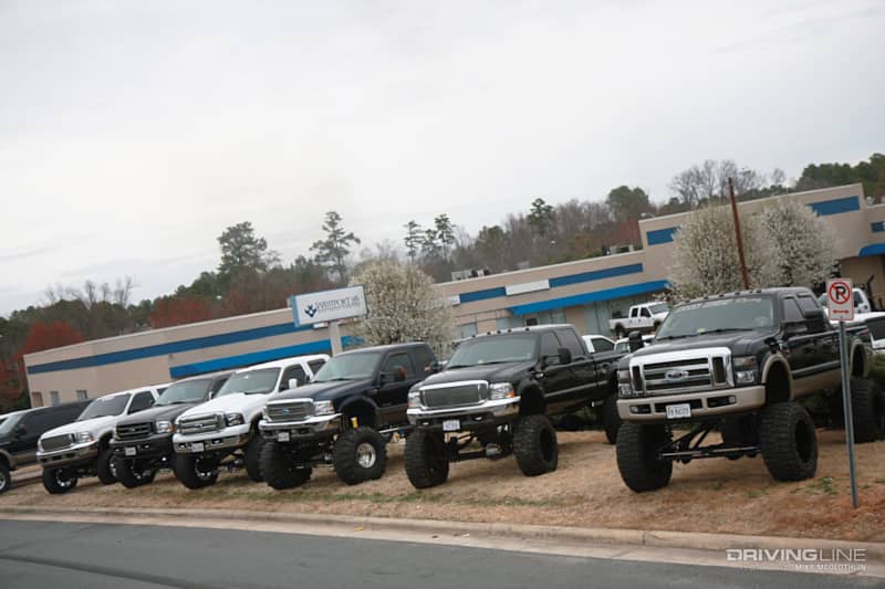 ford super duty trucks lined up at dealership on Mud Grappler tires