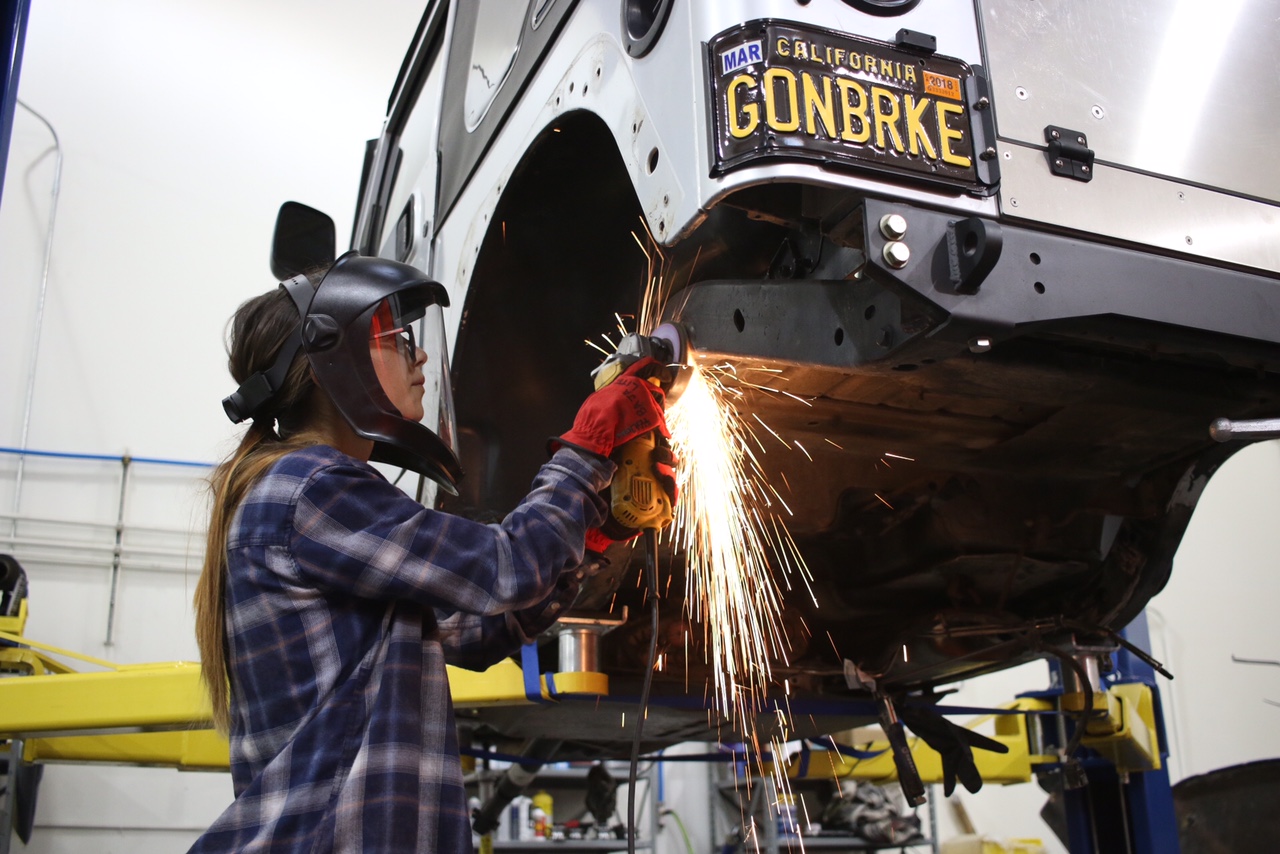 Courtney grinding on her Jeep during the build