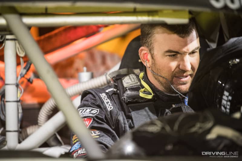 Loren Healy getting strapped in to race his leg of the Baja 1000