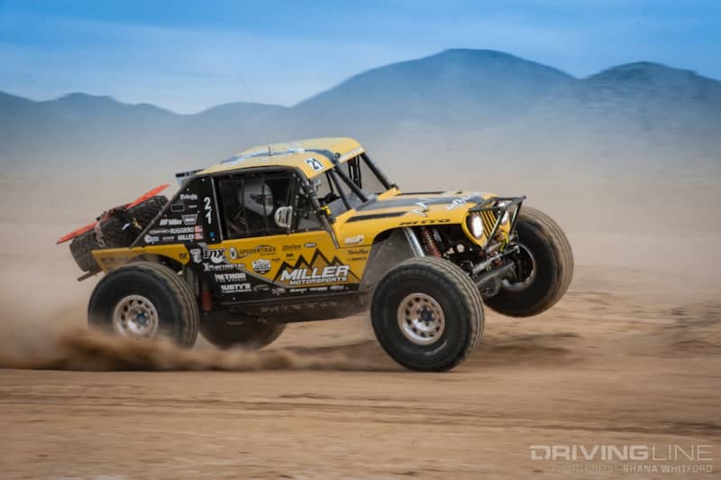 Erik Miller 3-wheeling through the fast desert bumps