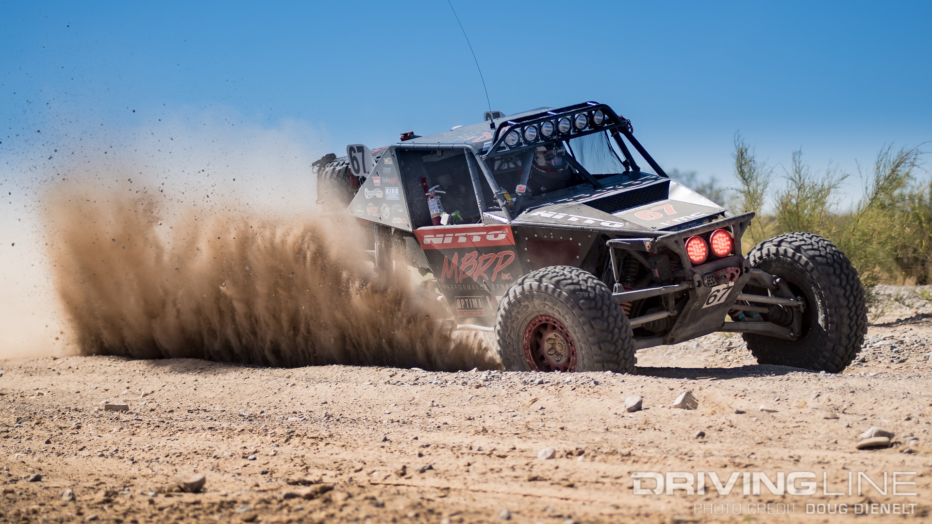 Loren Healy's Red Dragon race truck kicking up dirt