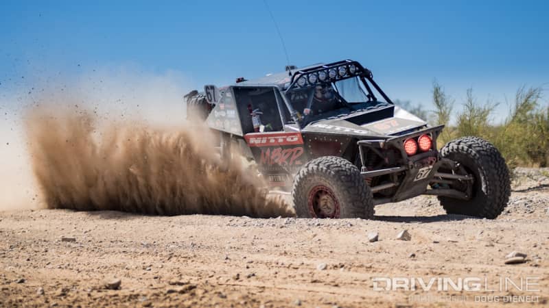 Loren Healy's Red Dragon race truck kicking up dirt