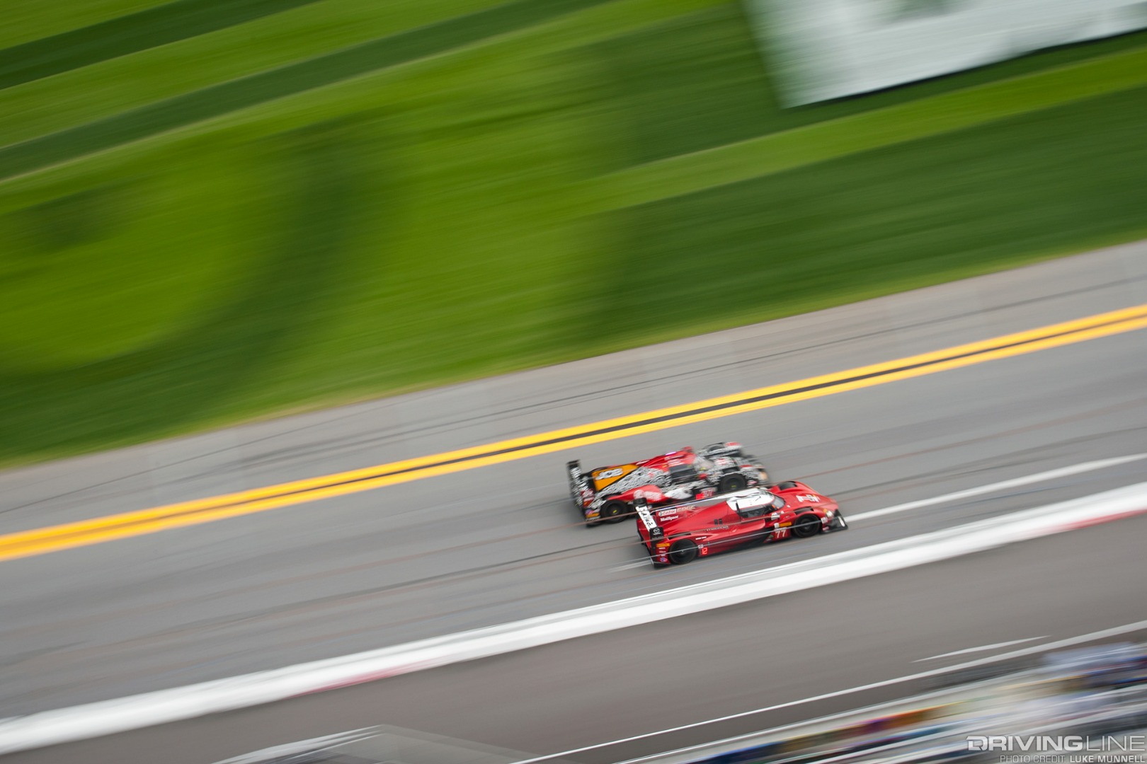 Mazda Team Joest pits at Rolex 24 Hours of Daytona RT24-P racing overhead pan front straight