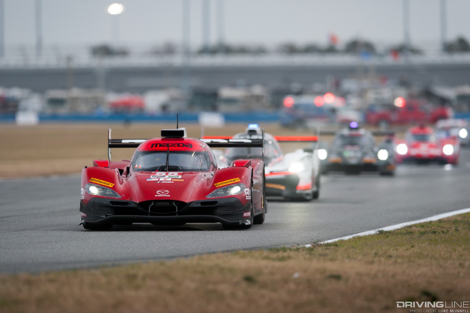 Mazda Team Joest pits at Rolex 24 Hours of Daytona RT24-P racing leading the pack