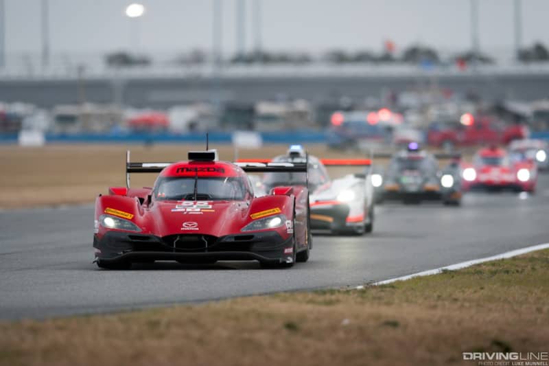 Mazda Team Joest pits at Rolex 24 Hours of Daytona RT24-P racing leading the pack