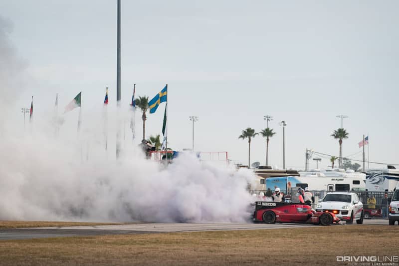 Mazda Team Joest at Rolex 24 Hours of Daytona RT24-P no. 55 car on fire flames extinguished smoke