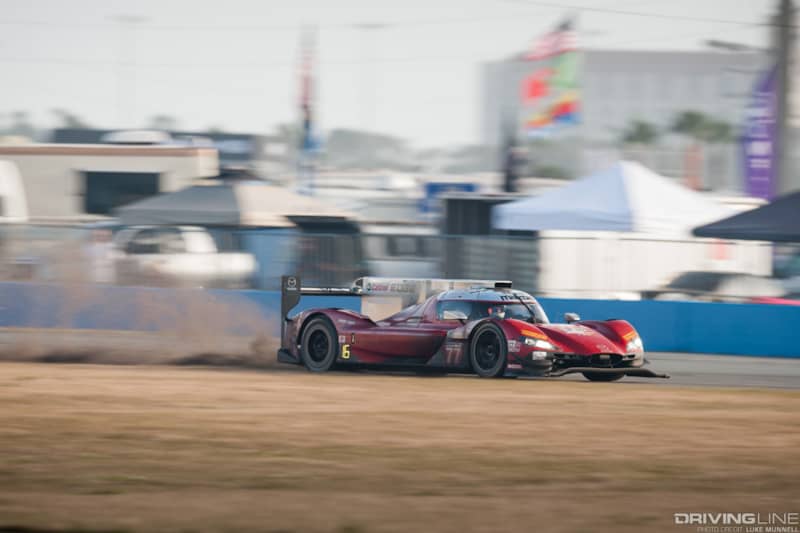 Mazda Team Joest at Rolex 24 Hours of Daytona RT24-P no. 77 driving off course through infield dirt