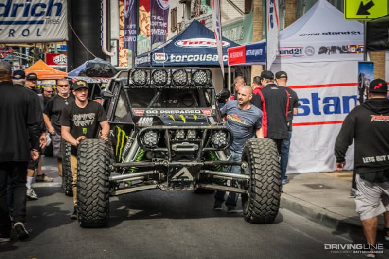 Campbells pushing their car through contingency