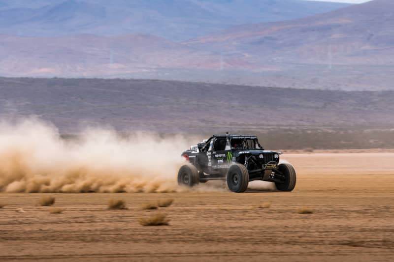 Casey Currie flying across the lake bed