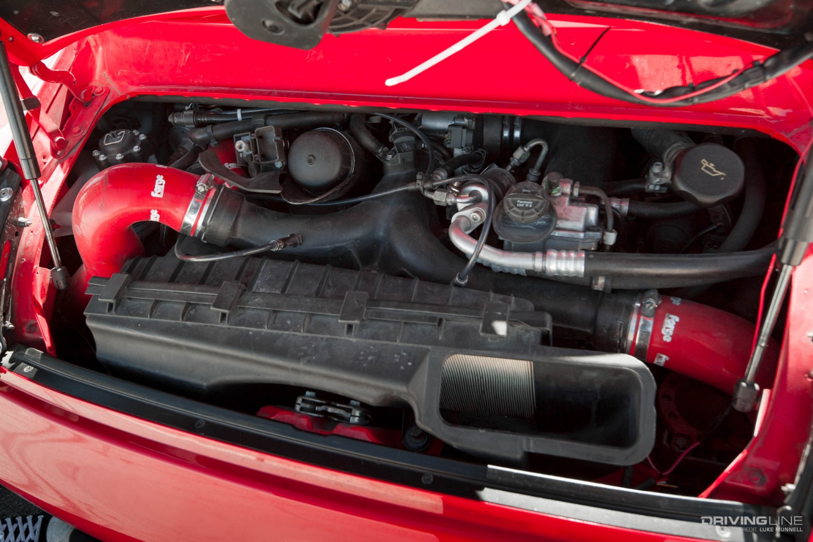 Driver Battles Porsche Engine