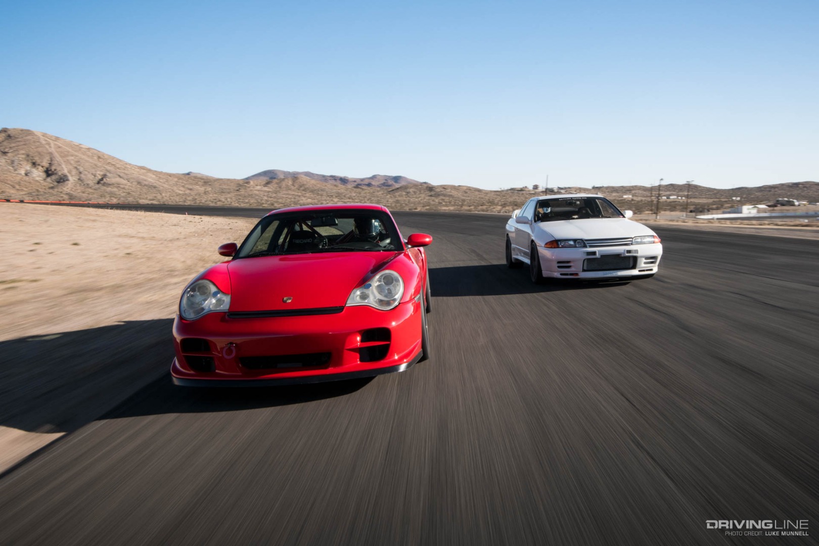 Driver Battles Porsche Nissan Track
