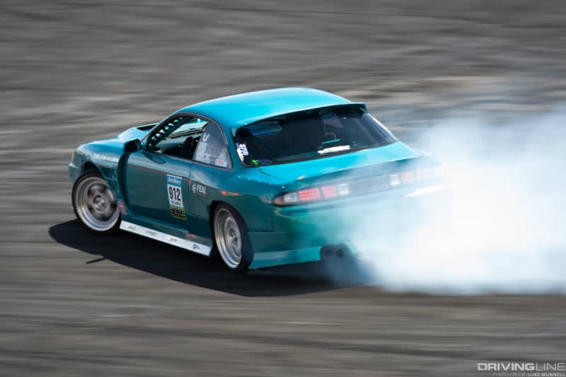 Top Drift round 1 SoCal pro-am drifting Meliton Villamor S14 Nissan 240SX drifting rear shot