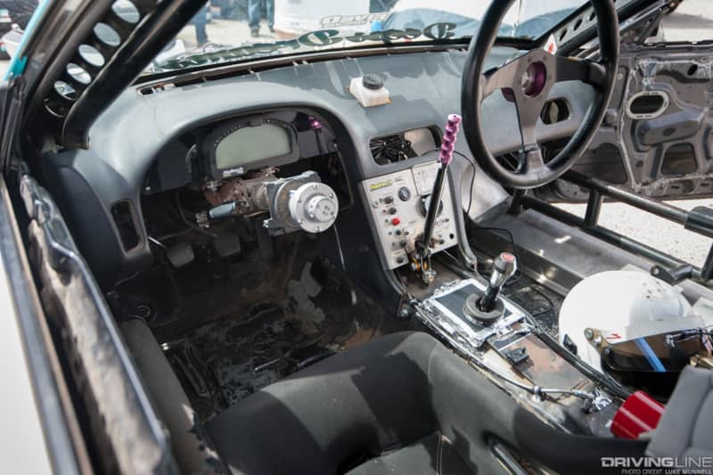 Top Drift round 1 SoCal pro-am drifting Shaun Doom white S13 Nissan 240SX fastback interior steering wheel dashboard