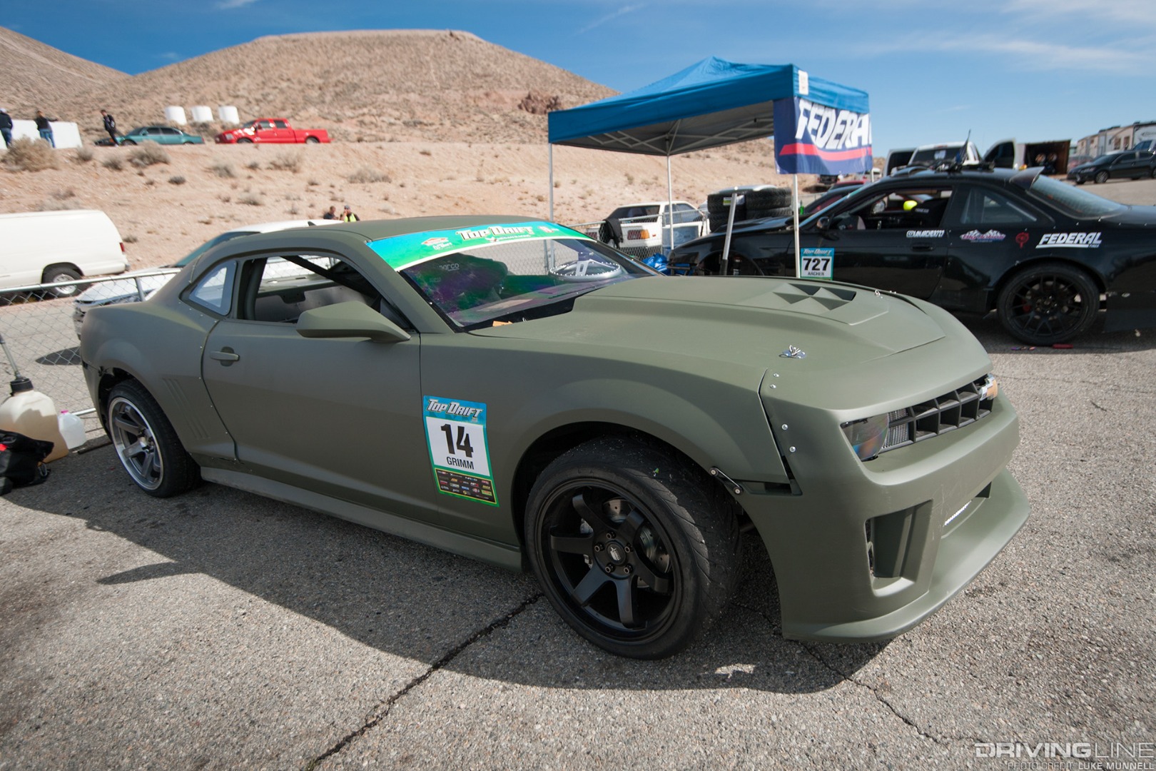 Top Drift round 1 SoCal pro-am drifting Alex Grimm Chevrolet Camaro front parked