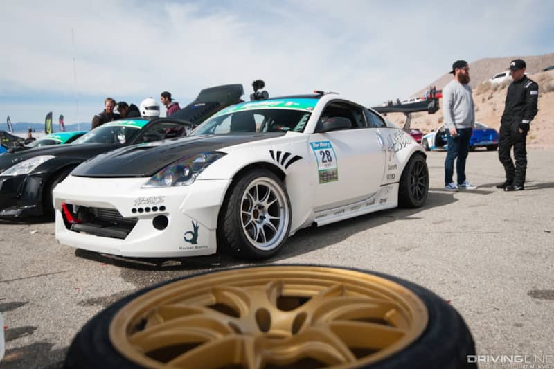 Top Drift round 1 SoCal pro-am drifting TJ Hunt Hunt & Co white Z33 Nissan 350Z front parked in pits
