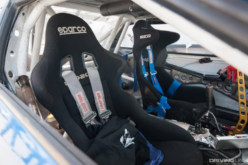 Top Drift round 1 SoCal pro-am drifting Samuel Guzman blue V8 S13 Nissan 240SX coupe interior racing seats roll cage harnesses