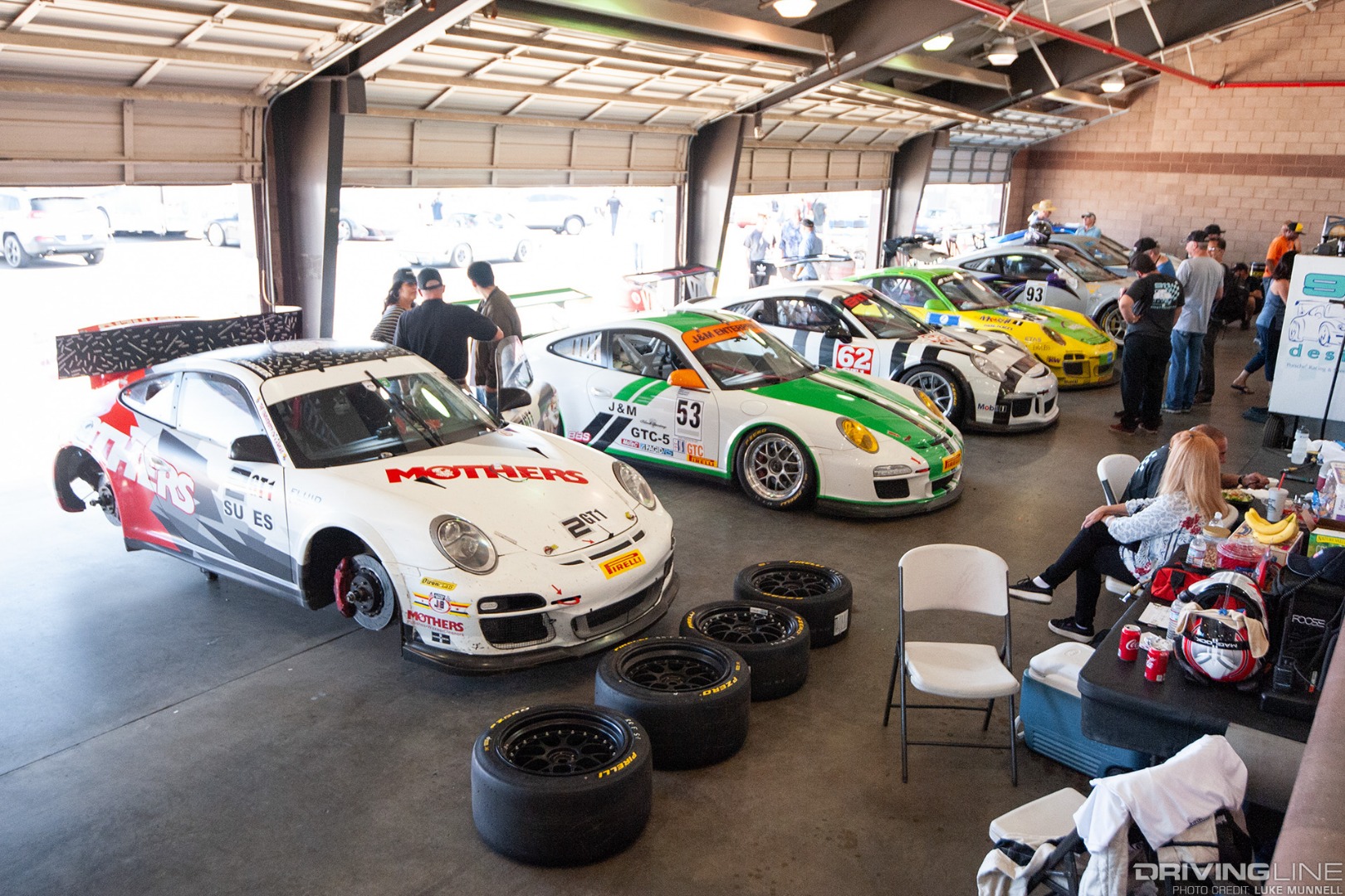 PCA California Festival of Speed at Auto Club Speedway pit garages with porsches
