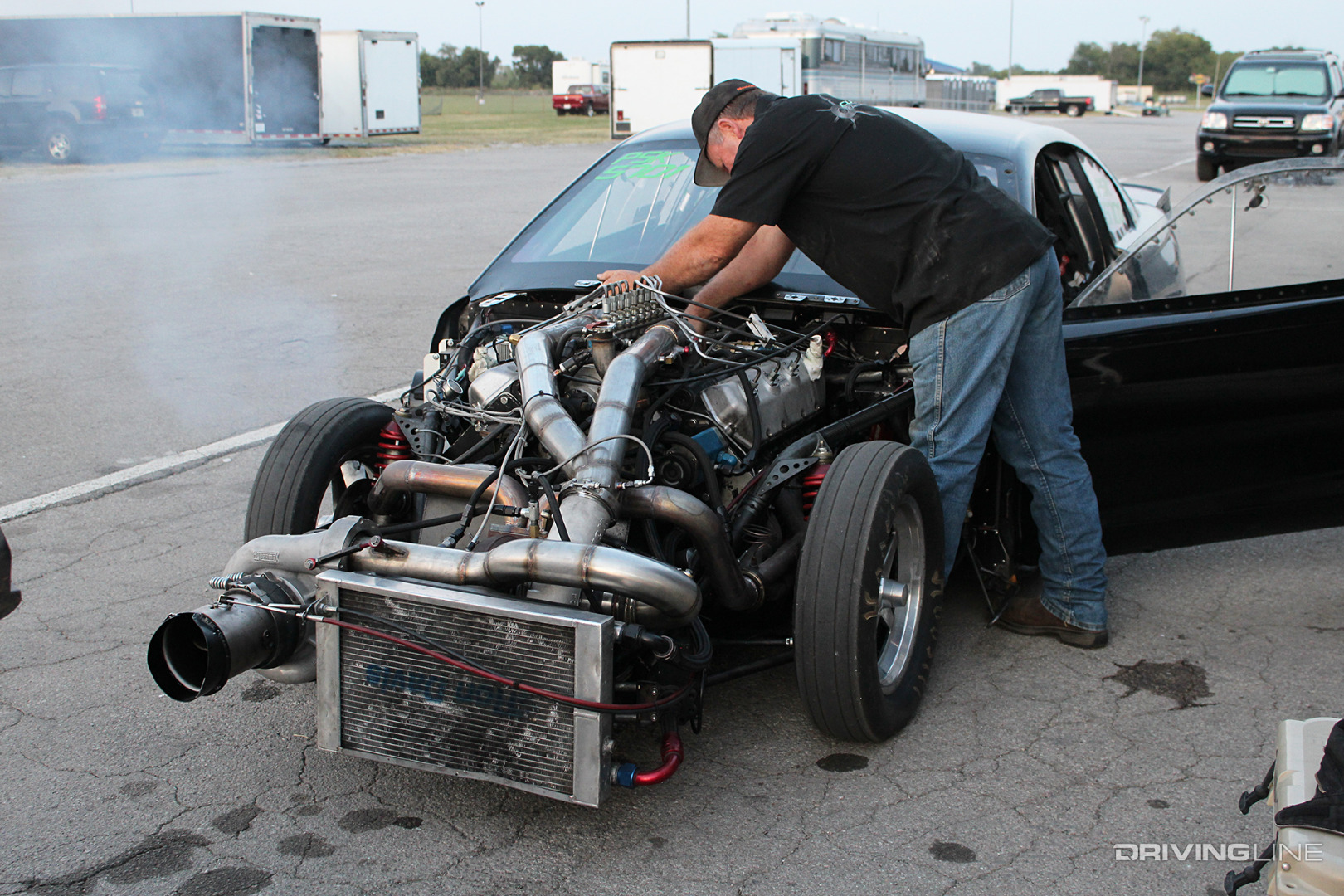 P-Pump Pro Mod Diesel Mustang with a man working on the engine