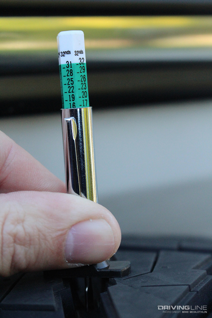 Using tread depth gauge on Nitto Ridge Grappler