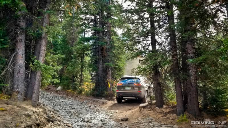 Jeep Cherokee Trailhawk on wooded trails