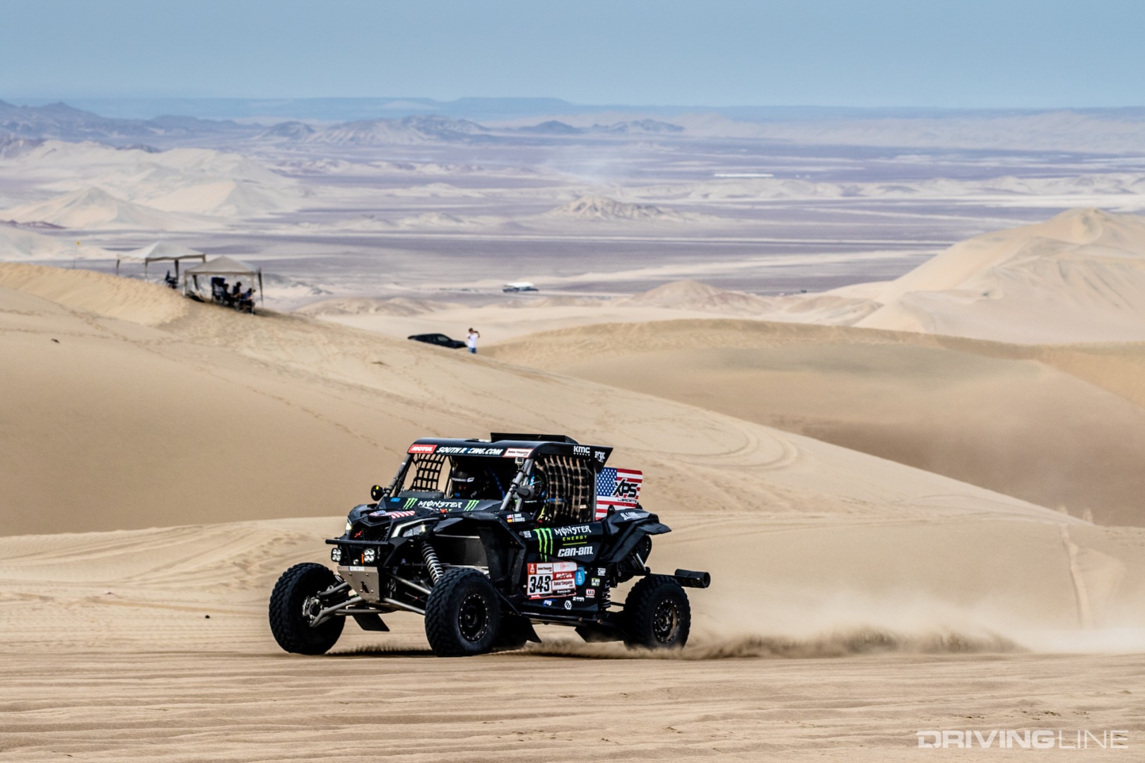 Casey driving through Pisco dunes