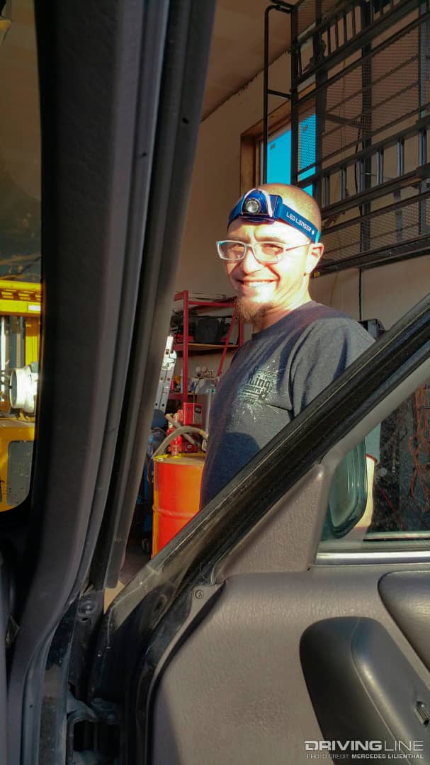 Andy still smiling while working on the Jeep Cherokee