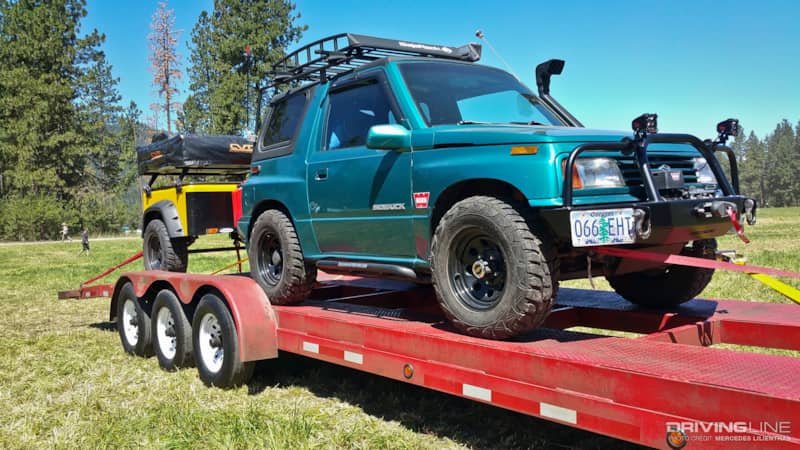 Suzuki Sidekick on flatbed trailer