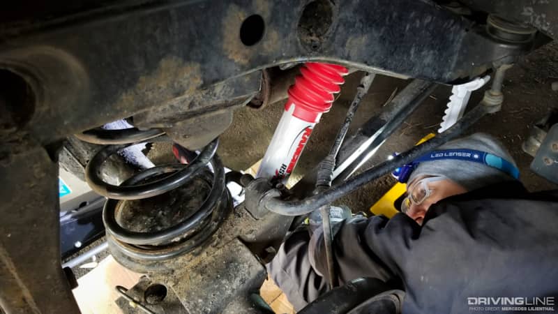 Andy Lilienthal tightening lower shock bolt