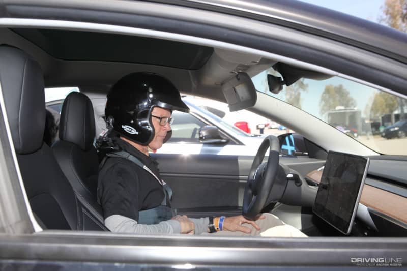 Randy Pobst behind the wheel of a Tesla Model 3 at Tesla Corsa