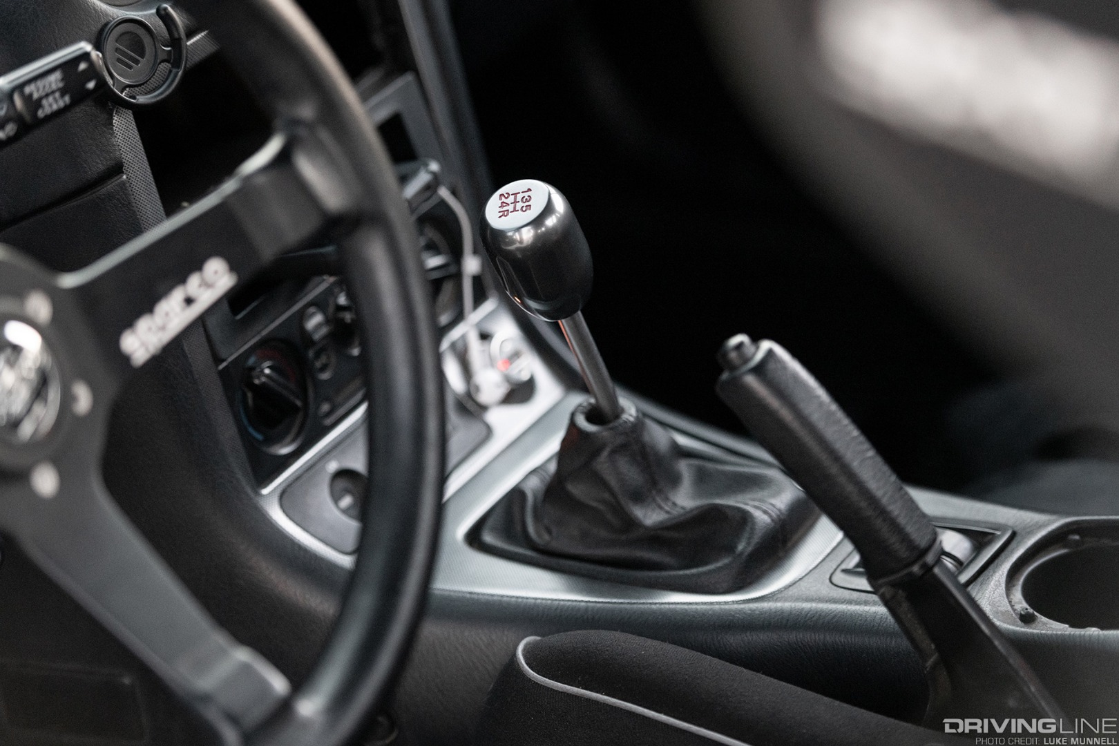 Driver Battles Mazda Miata Interior