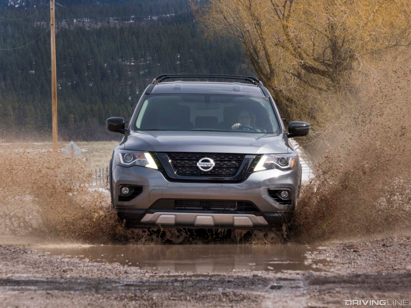 Front of Nissan Pathfinder Rock Creek Driving Through a Puddle