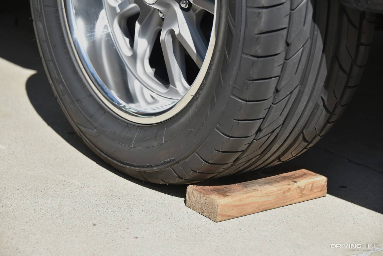Do's, Don'ts and Tools for Changing a Wheel and Tire | DrivingLine - Asphalt Tire Changing With A Wheel Chocks