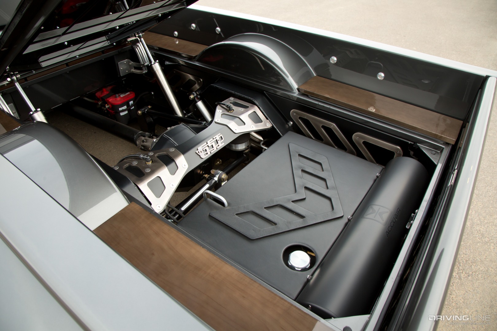 '56 Chevy Truck Bed opened up to reveal fuel cell, Accuair reservoir and rear end