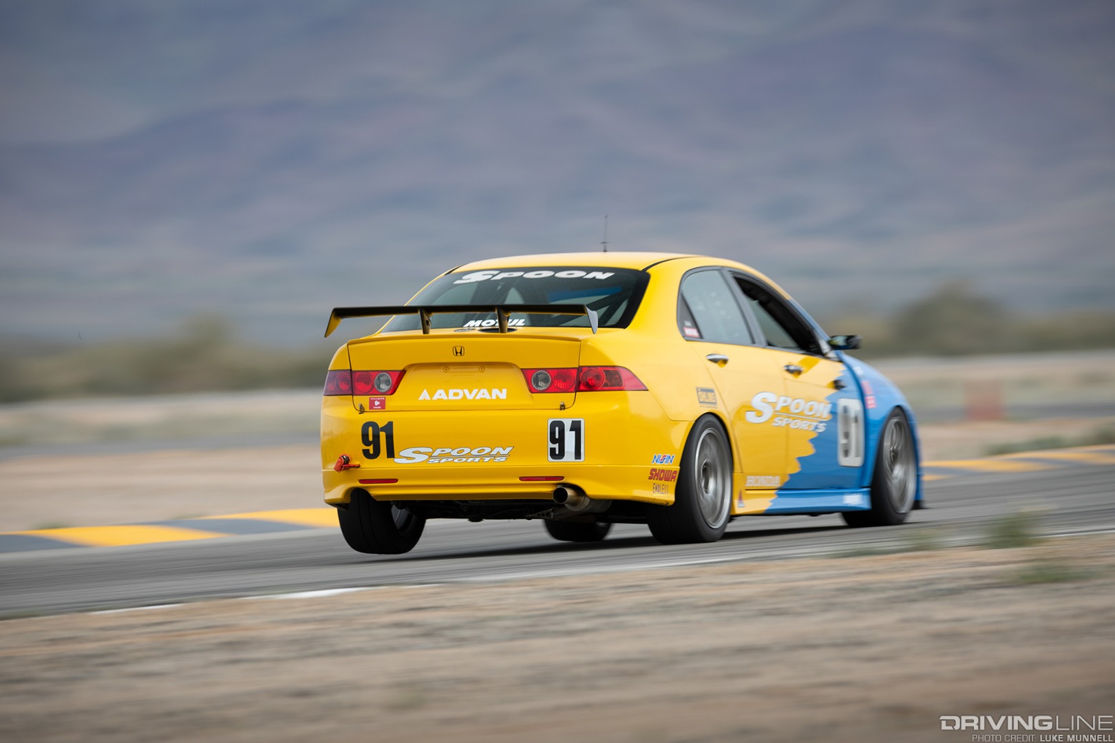 Spoon Sports Honda Accord Euro R lifting a rear wheel in VTEC Club competition