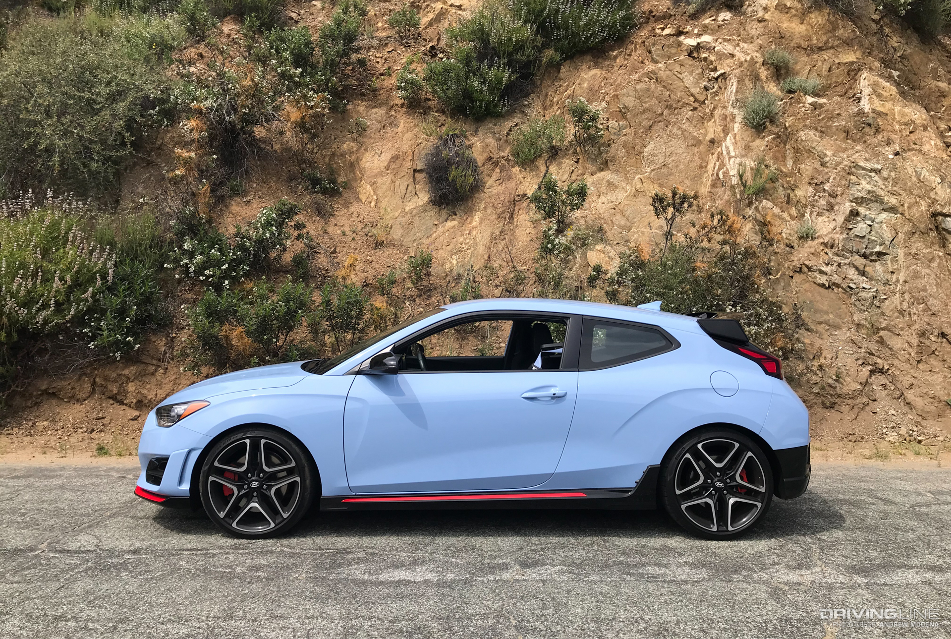 Side of a Hyundai Veloster N on a Canyon Road