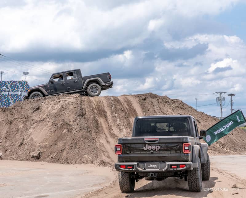 Jeep gladiator climbing an obstacle at jeep beach 2019