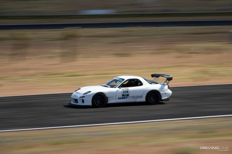 Driver Battles Mazda RX-7 on Track