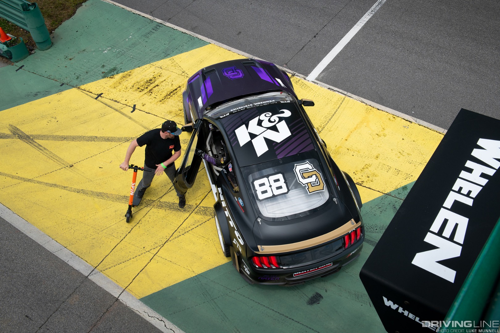 Hyperfest at VIR Chelsea Denofa Ford Mustang RTR from above with Vaughn Gittin Jr on a friggin scooter