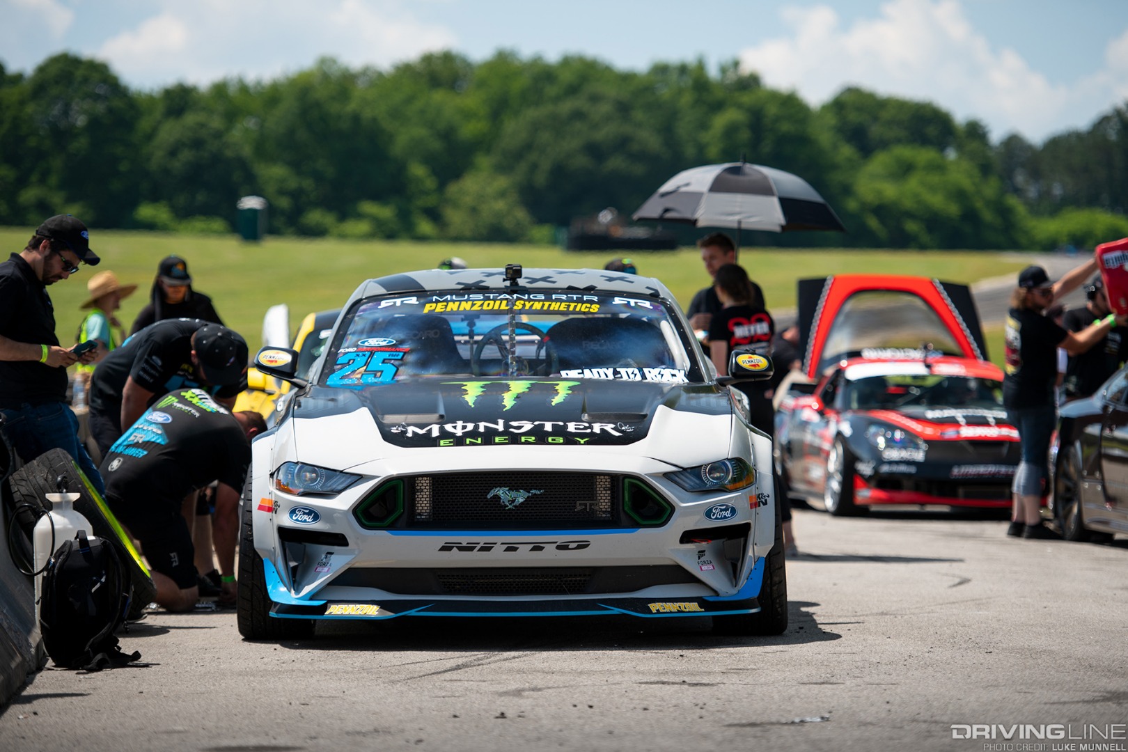 Hyperfest at VIR Vaughn Gittin Jr Ford Mustang RTR drift car in the pits tire change