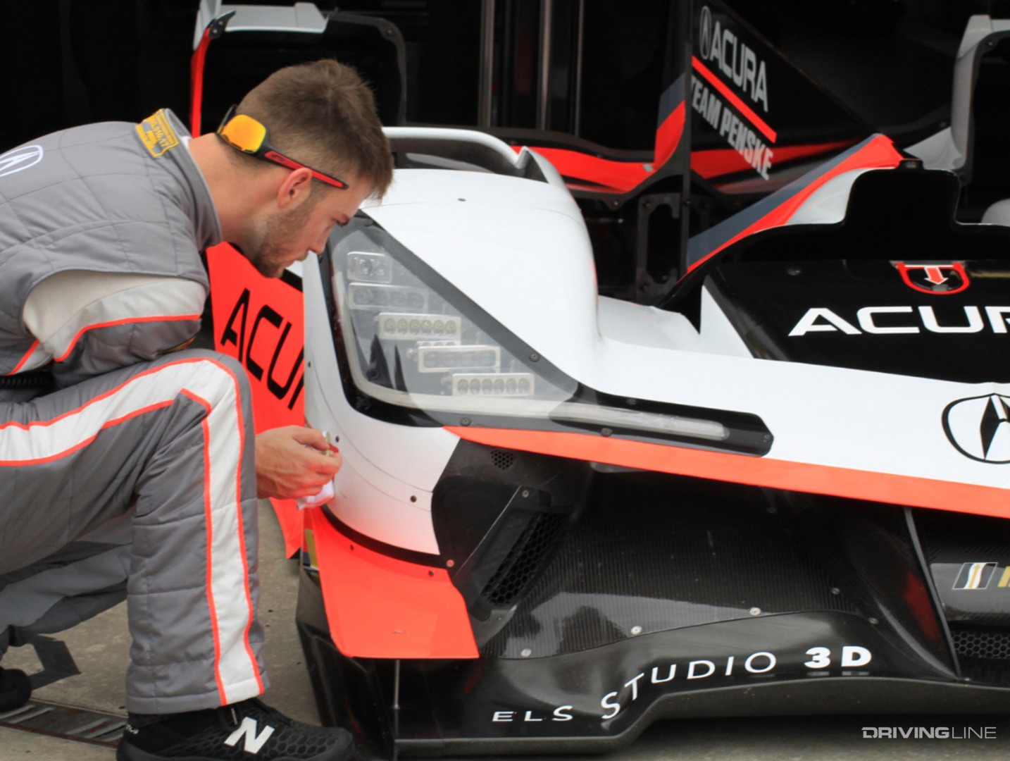 Applying protective Film to carbon fiber front end of racecar
