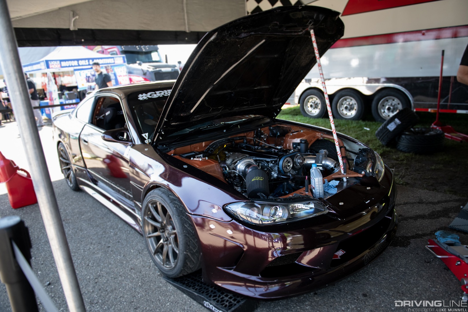 Gridlife Midwest Festival - Adam LZ 2JZ-GTE powered S15 Nissan Silvia drift car in pits hood up