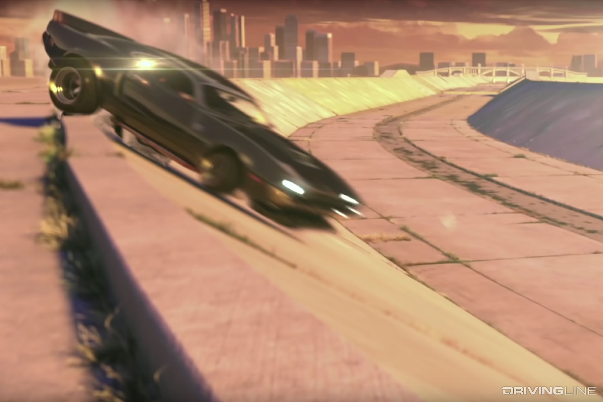 Car sliding along the top of a concrete river channel