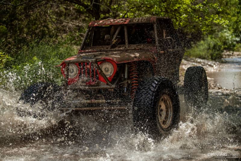 Casey Gilbert racing through a river