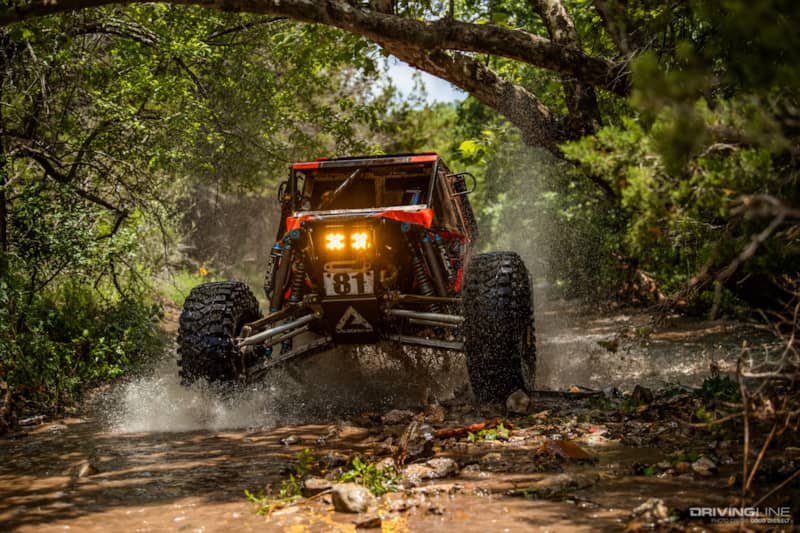 Levi Shirley racing through a river